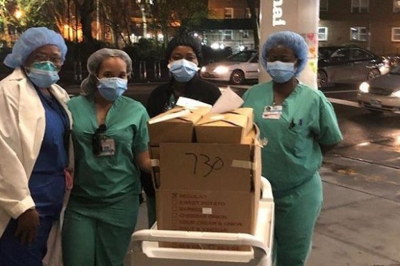 a group of people on a sidewalk