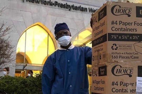 a man standing in front of a sign