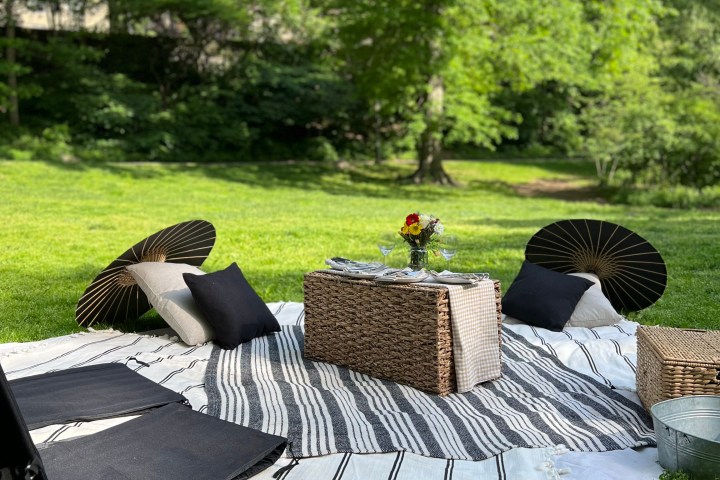 a group of lawn chairs sitting on top of a picnic table