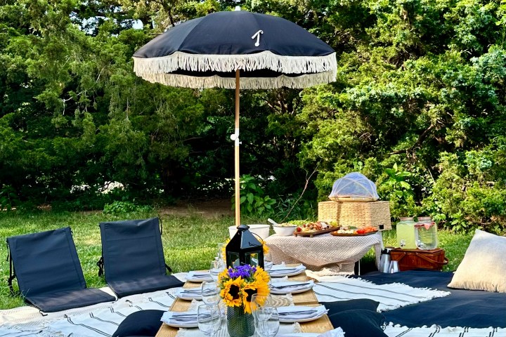 a couple of lawn chairs sitting on top of a picnic table