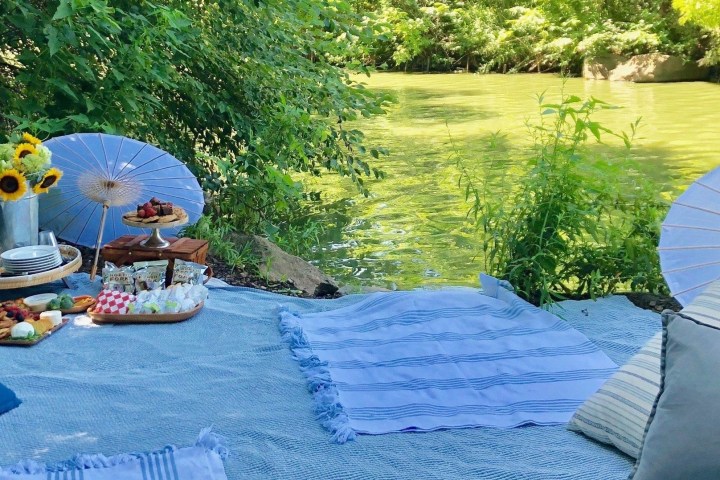 a table topped with a blue umbrella