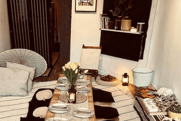 a room filled with furniture and vase on a table