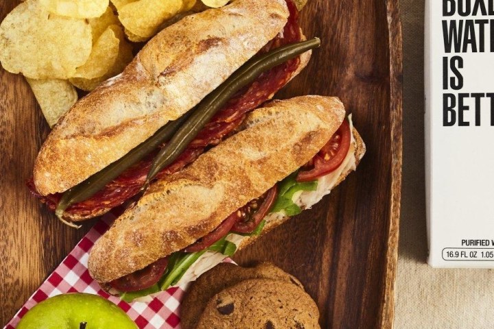 a sandwich sitting on top of a wooden table