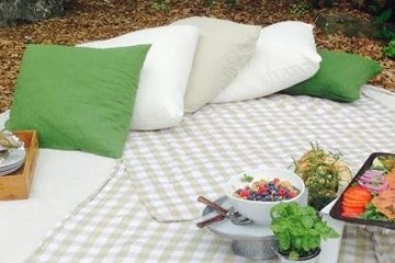 a table topped with lots of green grass