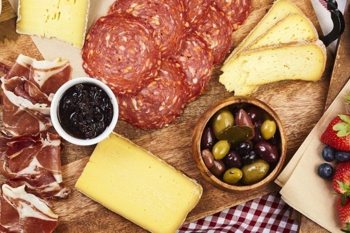 a box filled with different types of food on a plate