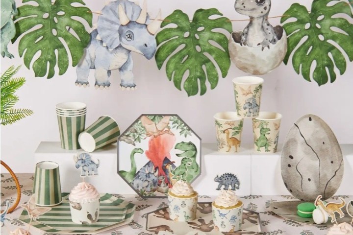 Dinosaur-themed party setup with dino decor and jungle motifs.